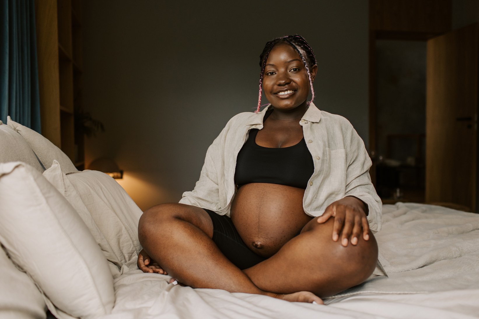 Pregnancy at Home Pregnant Woman Sitting in Bed