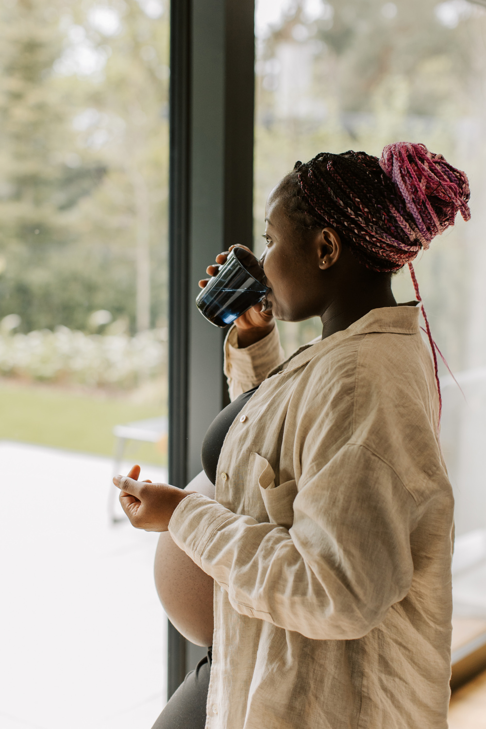 Pregnancy at Home Pregnant Woman Drinking Meds